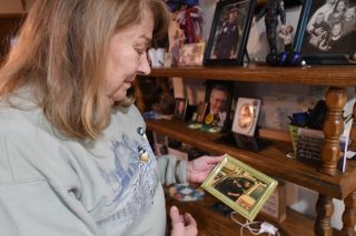 Above, Rosella Decker looks at a photo of her son, Tom Decker. Tom was killed in the line of duty in 2012. On Nov. 27, the community will gather at St. Boniface Church in Cold Spring, part of @christ_catholic Area Catholic Community, for a commemoration ceremony on the 10th anniversary of Officer Tom Decker's death. Read more about the event and how Rosella's faith has kept her going at the link in our bio. #ColdSpringPoliceMemorial #officers #police #catholic #rosary #catholicsofinstagram #ColdSpring