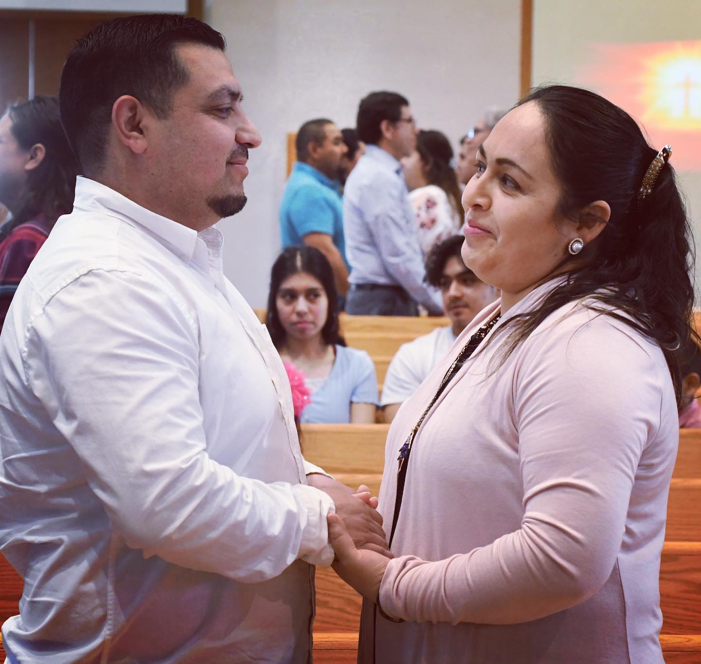 Carlos and Cecilia Chavez hold hands for a blessing by Bishop Donald Kettler during a special Mass  honoring Latino married couples at St. Mary in Melrose. #marriage #worldmarriageday #catholicsofinstagram